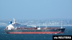 FILE - The Mercer Street tanker that was attacked off Oman's coast is seen near Cape Town, South Africa, Dec. 31, 2015, in this photo obtained from ship tracker website MarineTraffic.com. 