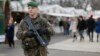 A French soldier patrols the Christmas market along Champs Elysees in Paris as part of the "Vigipirate" security plan, Dec. 23, 2014.