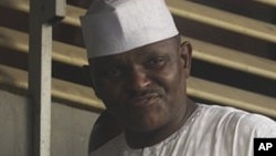 Maj. Hamza Al-Mustapha leaves the court after a verdict in Lagos, Nigeria, on Monday, Jan. 30, 2012.