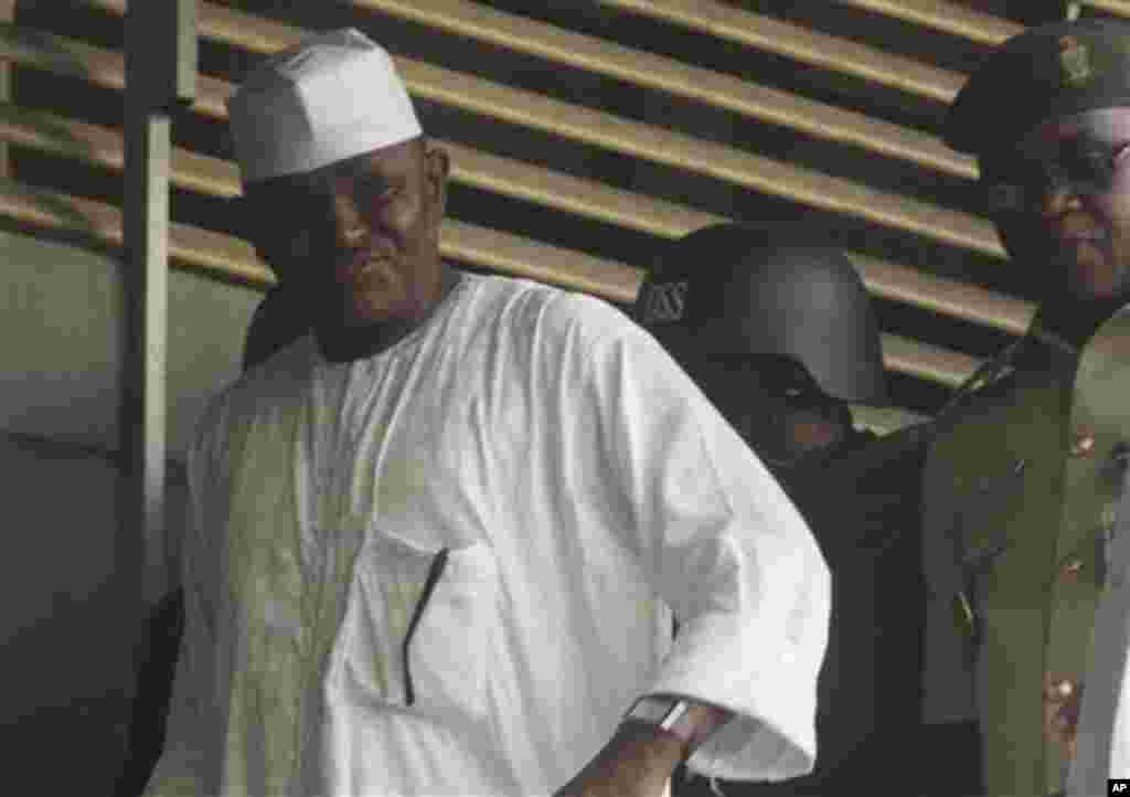 Maj. Hamza Al-Mustapha leaves the court after a verdict in Lagos, Nigeria, on Monday, Jan. 30, 2012.