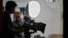 FILE - A cameraman films on the set during the during the shooting of a scene of tv drama serial 'Aadi Si Bewai' or 'Half-hearted,' in Islamabad, Oct. 29, 2024.