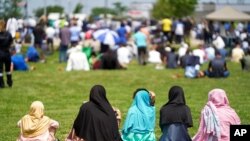 FILE - Thousands of people attend the funeral service for the victims of the deadly vehicle attack on five members of the Canadian Muslim community in London, Ontario, June 12, 2021. 