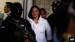Former Honduran first lady Rosa Elena Bonilla de Lobo smiles arrives to court for her sentencing on corruption charges in Tegucigalpa, Honduras, Aug. 20, 2019.