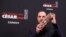 Alexis Manenti holds his best male newcomer Cesar award at a ceremony sometimes dubbed "French Oscars," in Paris, France, Feb. 28, 2020.