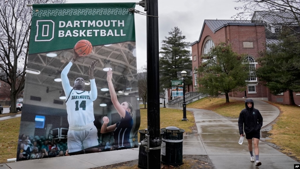 A student walks near the Alumni Gymnasium on the campus of Dartmouth College, Tuesday, March 5, 2024, in Hanover, N.H. (AP Photo/Robert F. Bukaty)