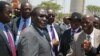 FILE - Zimbabwe's President Robert Mugabe (C-L) greets local chiefs at Zimplats mine, outside Harare.