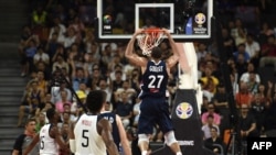 France's Rudy Gobert dunks the ball during the Basketball World Cup quarter-final game between US and France in Dongguan on September 11, 2019. 