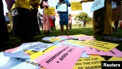 FILE - Supporters of the anti-gay law prepare for a procession backing the signing of the anti-gay bill into law, in Uganda's capital, Kampala.