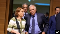 FILE - European Union foreign policy chief Josep Borrell, center, arrives for a meeting of EU foreign ministers at the European Council building in Luxembourg, Oct. 23, 2023.