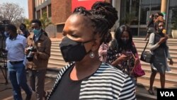 FILE: Beatrice Mtetwa, a member of Zimbabwe Lawyers of Human Rights, talks to reporters outside the Harare Magistrates Court in Harare, Zimbabwe, Aug. 18, 2020. Mtetwa said she did nothing wrong in her quest to secure bail for journalist Chin’ono.