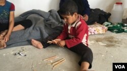 Child displaced by fighting in his village southeast of Mosul in Makhmour, Iraq, April 14, 2016, (S. Behn / VOA)