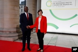 FILE - Burundi's Prime Minister Alain-Guillaume Bunyoni and French Foreign Minister Catherine Colonna pose at the New Global Financial summit in Paris Thursday, June 22, 2023.