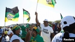 Supporters of former South African President Jacob Zuma, who was sentenced to a 15-month imprisonment by the Constitutional Court, sing and dance in front of his home in Nkandla, South Africa, July 3, 2021.