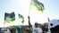 Supporters of former South African President Jacob Zuma, who was sentenced to a 15-month imprisonment by the Constitutional Court, sing and dance in front of his home in Nkandla, South Africa, July 3, 2021.