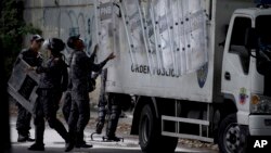 Venezuelan police set up a check-point outside the morgue, where the body of the late rebel police officer Oscar Perez is being held in Caracas, Venezuela, Jan. 17, 2018.