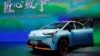 FILE - A GAC Aion Y electric vehicle (EV) is seen displayed at a booth of GAC Group during a media day for the Auto Shanghai show in Shanghai, China, April 19, 2021. 