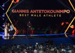 NBA player Giannis Antetokounmpo of the Milwaukee Bucks, accepts the award for best male athlete at the ESPY Awards, July 10, 2019, at the Microsoft Theater in Los Angeles.