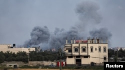 FILE: Israeli strikes seen from Rafah