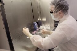 A pharmacist undergoes training in preparation for the distribution of the Pfizer coronavirus vaccine at a Mount Sinai Health System pharmacy in the Queens borough of New York City, in this handout photo released Dec. 10, 2020.