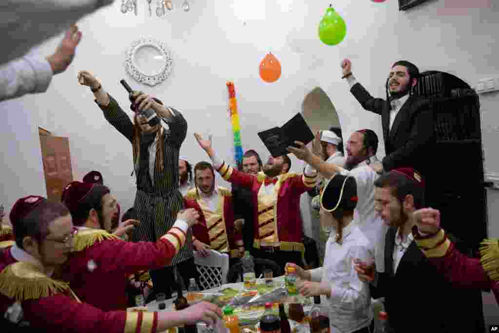 Ultra-Orthodox Jews celebrate during the Jewish holiday of Purim, in the Mea Shearim ultra-Orthodox neighborhood of Jerusalem.