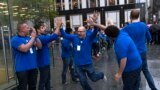 Apple employees celebrate outside the Apple store on New York's 5th Avenue, shortly before the new Apple iPad Air tablets went on sale. 