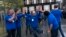 Apple employees celebrate outside the Apple store on New York's 5th Avenue, shortly before the new Apple iPad Air tablets went on sale. 