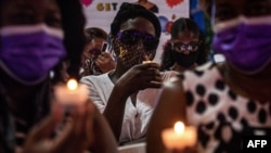 People attend a vigil in honor of Haiti's slain president Jovenel Moise, in Little Haiti neighborhood, Miami, Florida, on July 16, 2021.