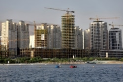 FILE - Residential towers are under construction on the northwestern edge of Tehran, Iran, July 6, 2019.