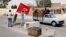 Protesters, who are demanding jobs and a share in revenue from the area's natural resources, block the road usually used by foreign oil companies to go the oil field in Tataouine, Tunisia, May 12, 2017. Picture taken May 12, 2017. 