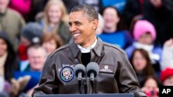 Presiden Obama melakukan kampanye singkat di Green Bay, Wisconsin sebelum bertolak ke Las Vegas, Nevada hari Kamis (1/11).