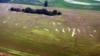 "We the People," the beginning of the preamble of the U.S. Constitution, is seen cut into a wheat field on the farm of Jack Coleman in Ronks, Pa., June 26, 2003. (AP Photo/Chris Gardner)