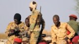 South Sudanese soldiers are seen during a ceremony marking the restarting of crude oil pumping at the Unity oil fields, Jan. 21, 2019. Beginning in March, the government will deduct one day's salary from civil servants' paychecks each month to support the recent peace deal.