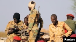 South Sudanese soldiers are seen during a ceremony marking the restarting of crude oil pumping at the Unity oil fields, Jan. 21, 2019. Beginning in March, the government will deduct one day's salary from civil servants' paychecks each month to support the recent peace deal.