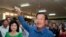 FILE - Prime Minister Hun Sen of the Cambodian People's Party shows off his ballot paper before voting in local elections at Takhmau polling station in Kandal province, southeast of Phnom Penh, June 4, 2017. 