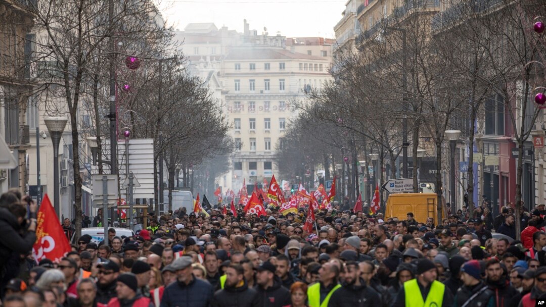 Strikers march during a demonstration in Marseille, southern France, Jan. 14, 2020. 