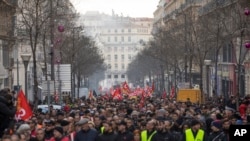 Strikers march during a demonstration in Marseille, southern France, Jan. 14, 2020. 