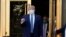 FILE - President Donald Trump walks out of Walter Reed National Military Medical Center to return to the White House after receiving treatments for COVID-19 in Bethesda, Md., Oct. 5, 2020.