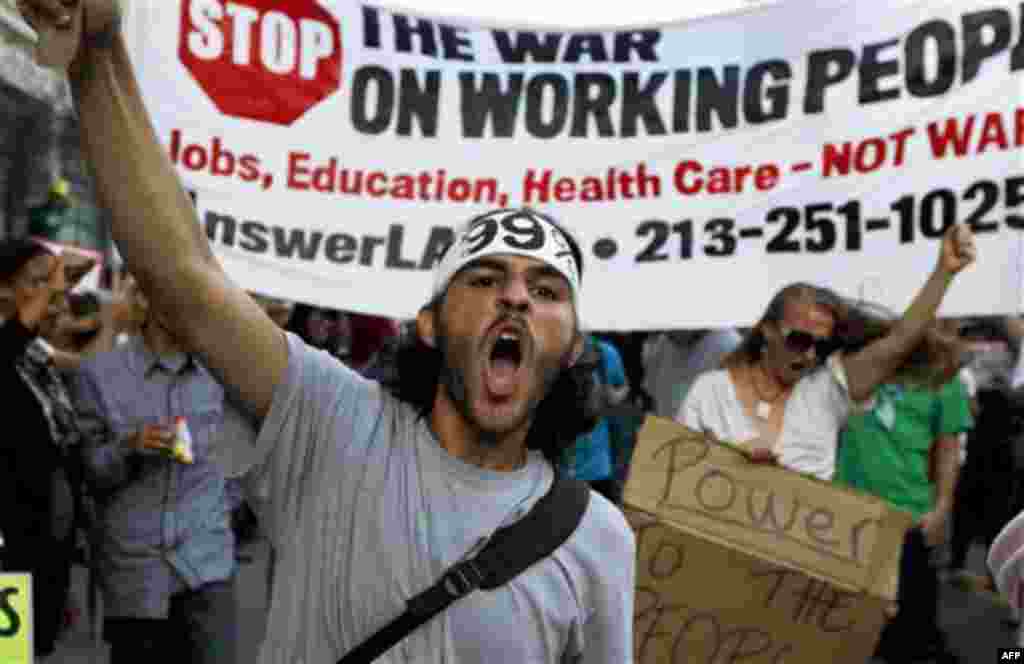 Anti-Wall Street demonstrators march in downtown Los Angeles, Monday, Oct. 3, 2011. The demonstrators entering their third day of a campout protest at Los Angeles City Hall said Monday they're planning to continue their action as long as it takes to buil