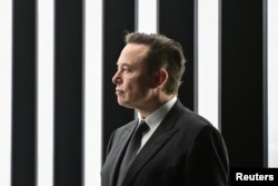 FILE PHOTO: Elon Musk attends the opening ceremony of the new Tesla Gigafactory for electric cars in Gruenheide, Germany, March 22, 2022. (Patrick Pleul/Pool via REUTERS/File Photo)