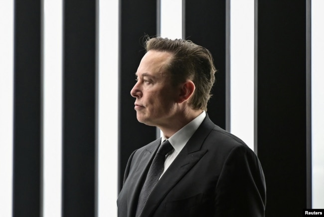 FILE PHOTO: Elon Musk attends the opening ceremony of the new Tesla Gigafactory for electric cars in Gruenheide, Germany, March 22, 2022. (Patrick Pleul/Pool via REUTERS/File Photo)