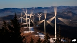  The blades of wind turbines catch the breeze at the Saddleback Ridge wind farm in Carthage, Maine, March 19, 2019.