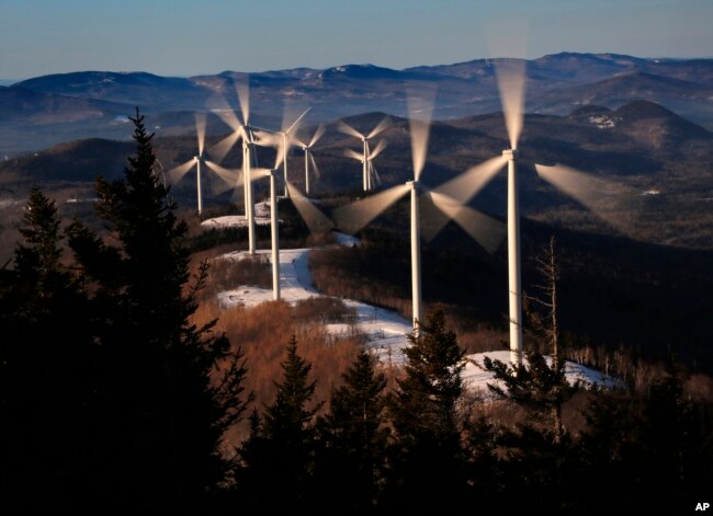 The blades of wind turbines catch the breeze at the Saddleback Ridge wind farm in Carthage, Maine, March 19, 2019.