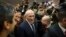 FILE - Mikhail Khodorkovsky, center, is seen arriving at his first news conference following his release in Berlin, Dec. 22, 2013.