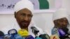 FILE - Former Sudanese Prime Minister Sadiq al-Mahdi, left, leader of the Umma political party, speaks during a press conference in Khartoum, Feb. 6, 2020.