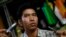 Political prisoner Kyaw Zin Min talks to reporters after his release in front of Insein prison in Rangoon, Burma, Apr. 23, 2013. 