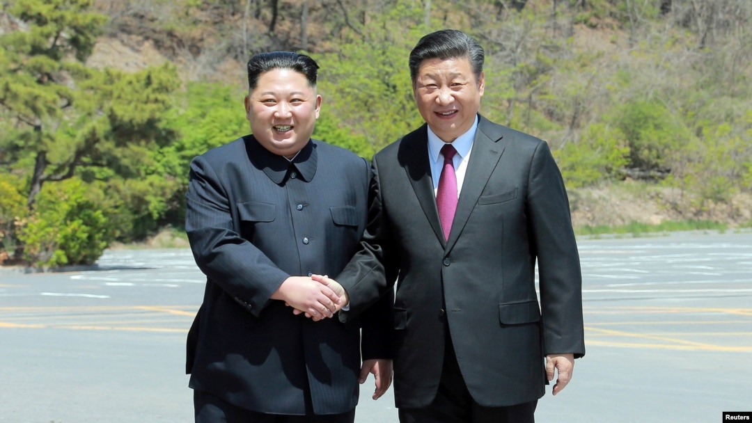 North Korean leader Kim Jong Un shakes hands with China's President Xi Jinping, in Dalian, China in this undated photo released on May 9, 2018 by North Korea's Korean Central News Agency (KCNA).
