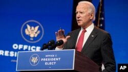 President-elect Joe Biden, accompanied by Vice President-elect Kamala Harris, speaks at The Queen theater, Nov. 19, 2020, in Wilmington, Del.