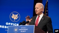 President-elect Joe Biden, accompanied by Vice President-elect Kamala Harris, speaks at The Queen theater, Nov. 19, 2020, in Wilmington, Del.