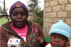 This woman, who is holding her baby tells VOA the locals are used to cool weather illnesses and have their own herbal concoctions to treat them. (Photo: Matiado Vilme / VOA)