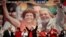 FILE - Brazil's President Luiz Inacio Lula da Silva, center, raises arms with his Chief of Staff Dilma Rousseff at an annual Workers Party Congress in Brasilia, Brazil, where the party announced Rousseff as the party's 2010 presidential candidate, Feb. 20